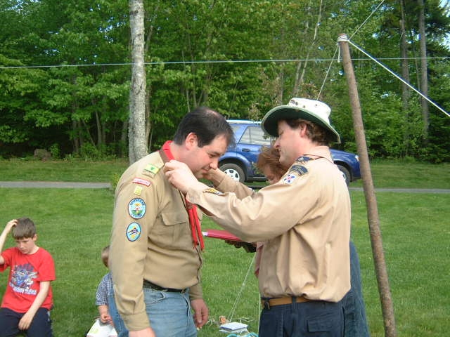 Akela presents King Louie with medal